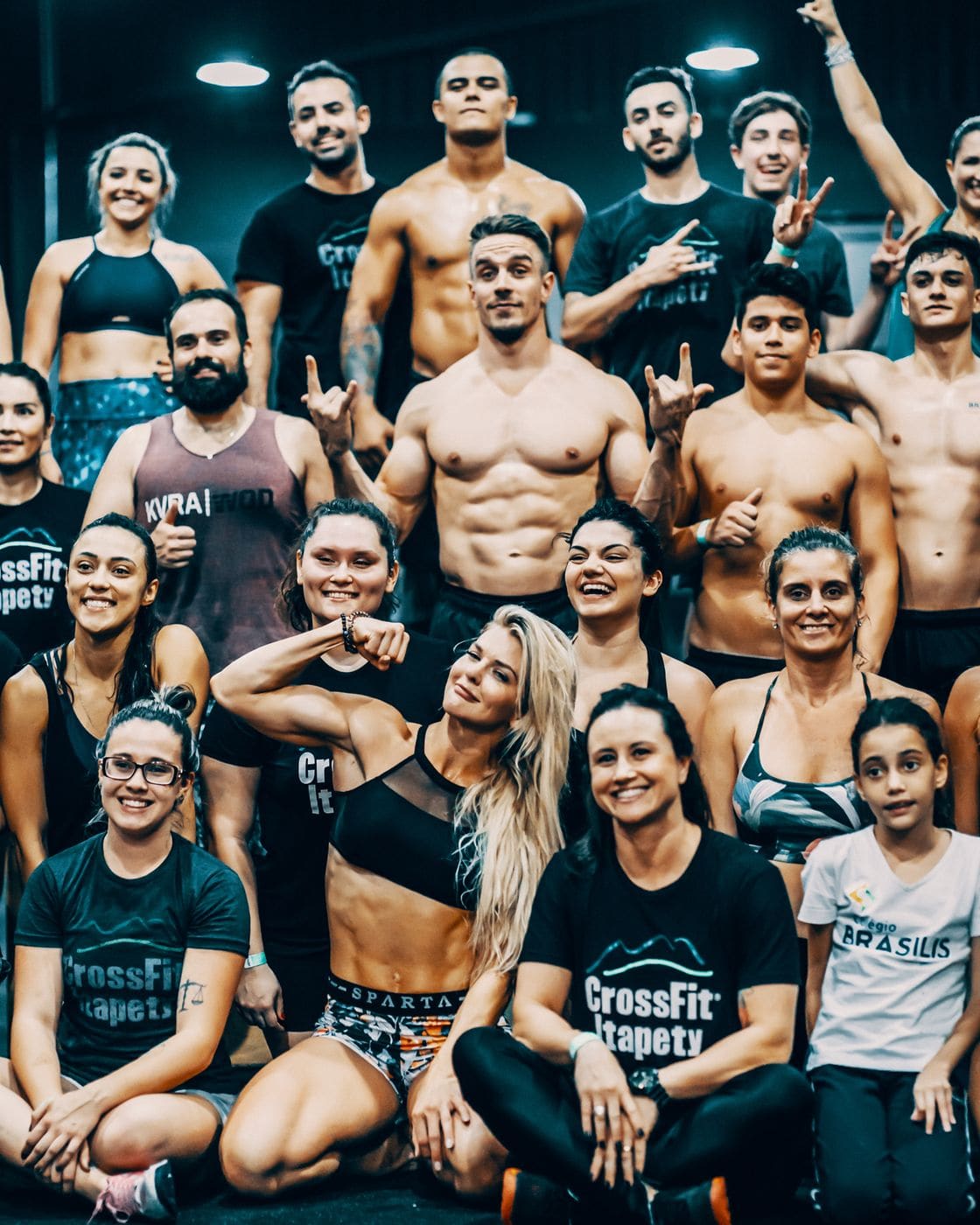 A gym community celebrating together after a workout